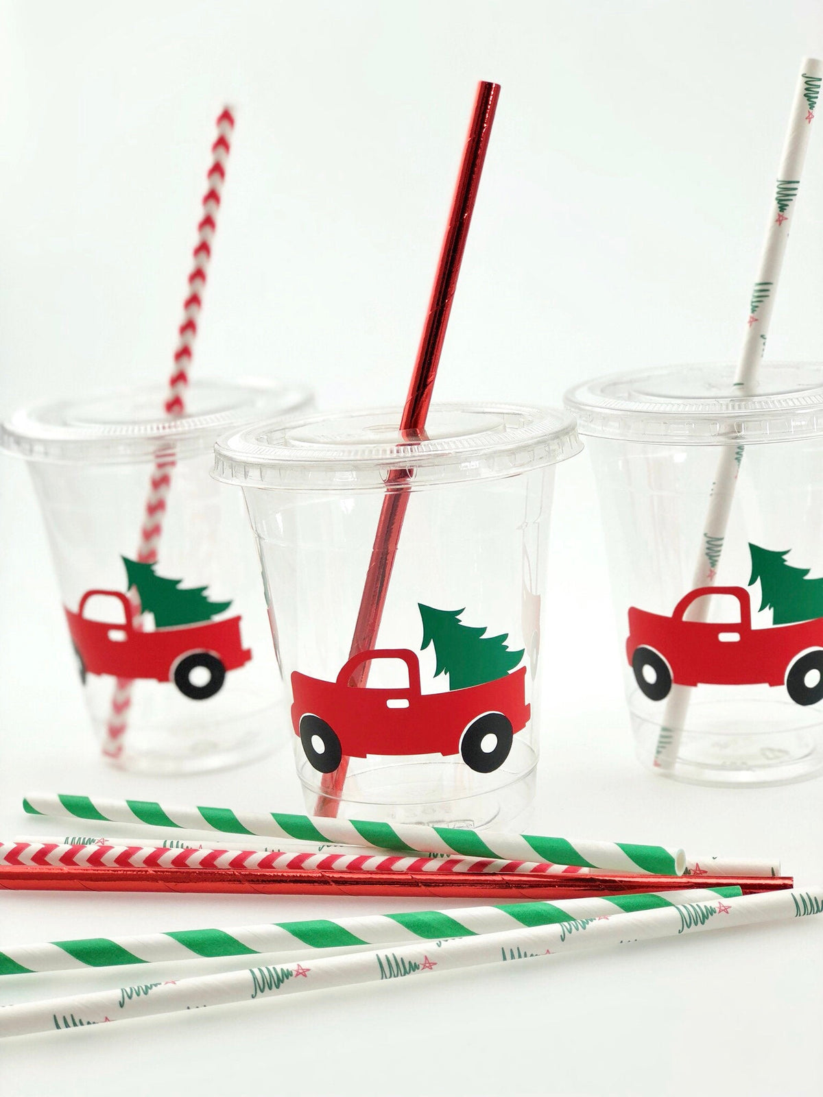 https://www.steshaparty.com/cdn/shop/products/christmas-red-truck-tree-plastic-cups-119196_1200x.jpg?v=1691025483